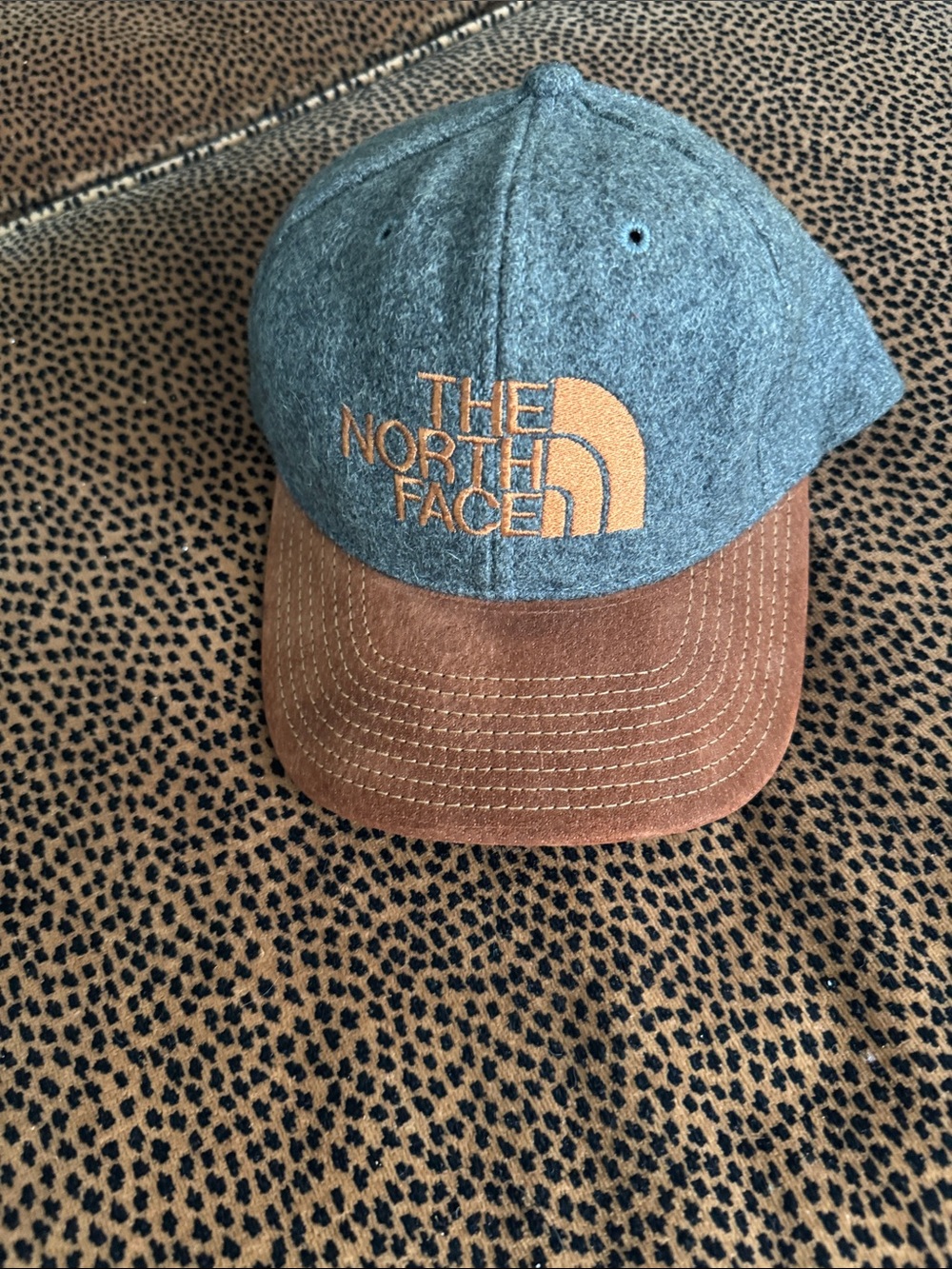 The North Face Gray Wool-Blend Cap with Brown Suede Brim and Gold Logo